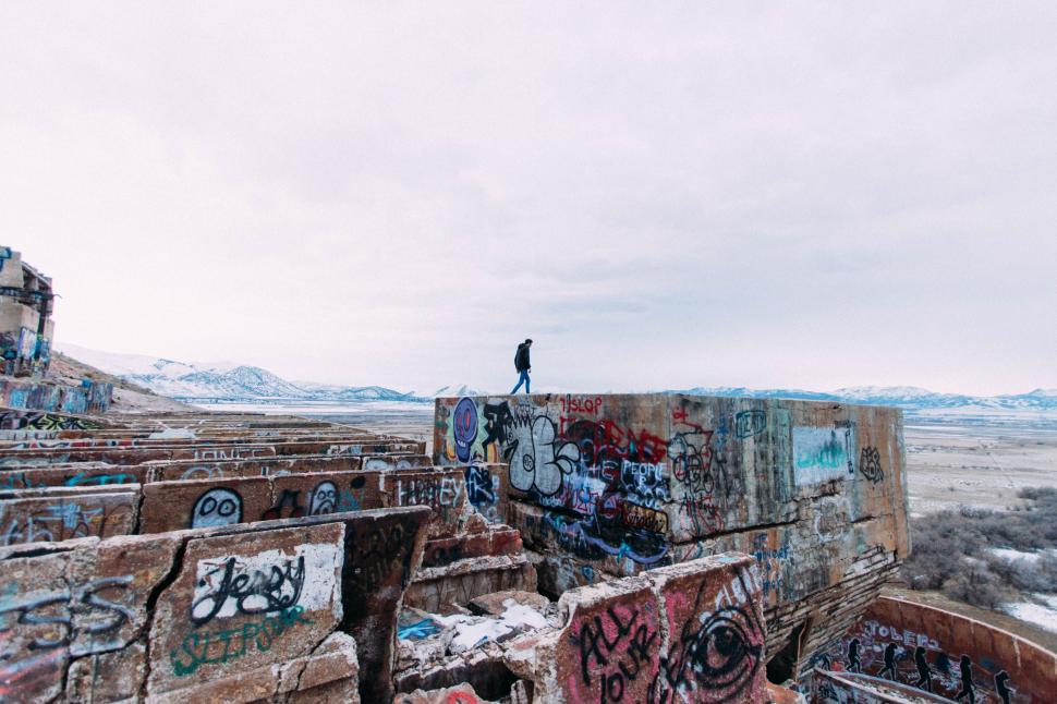 Free Image of Man Standing on Top of Skateboard Ramp 