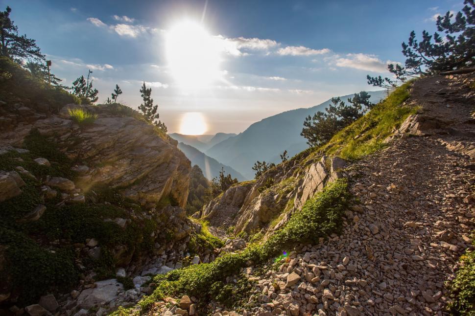 Free Image of Sun Shining Over Mountains and Valleys 