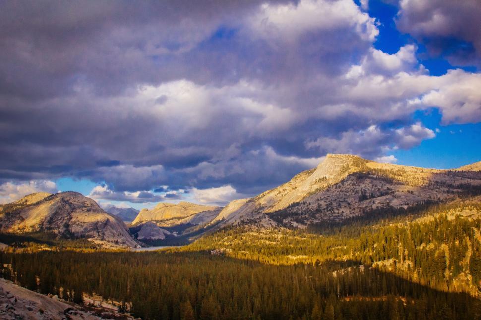 Free Image of Majestic Mountain Range Beneath Cloudy Sky 