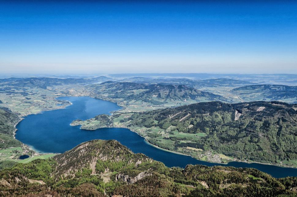Free Image of Majestic Lake Surrounded by Towering Mountains 