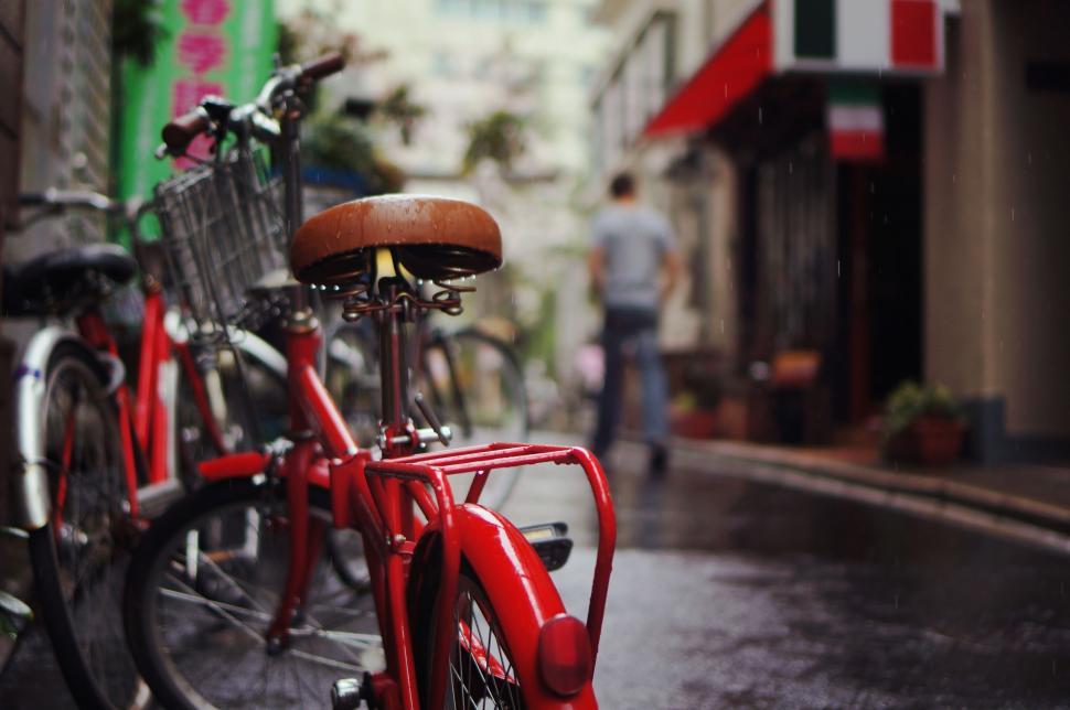 Free Image of Two Red Bikes Parked Together 