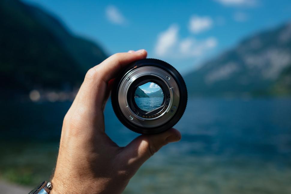 Free Image of Person Holding Camera Lens 