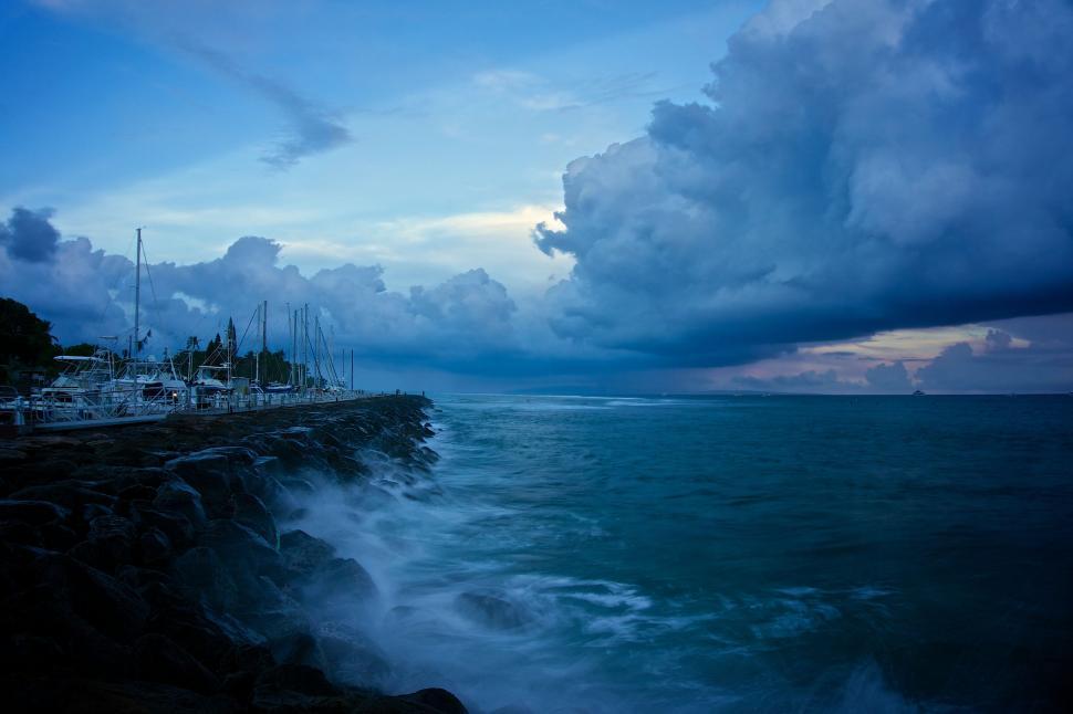 Free Image of Large Body of Water Under a Cloudy Sky 