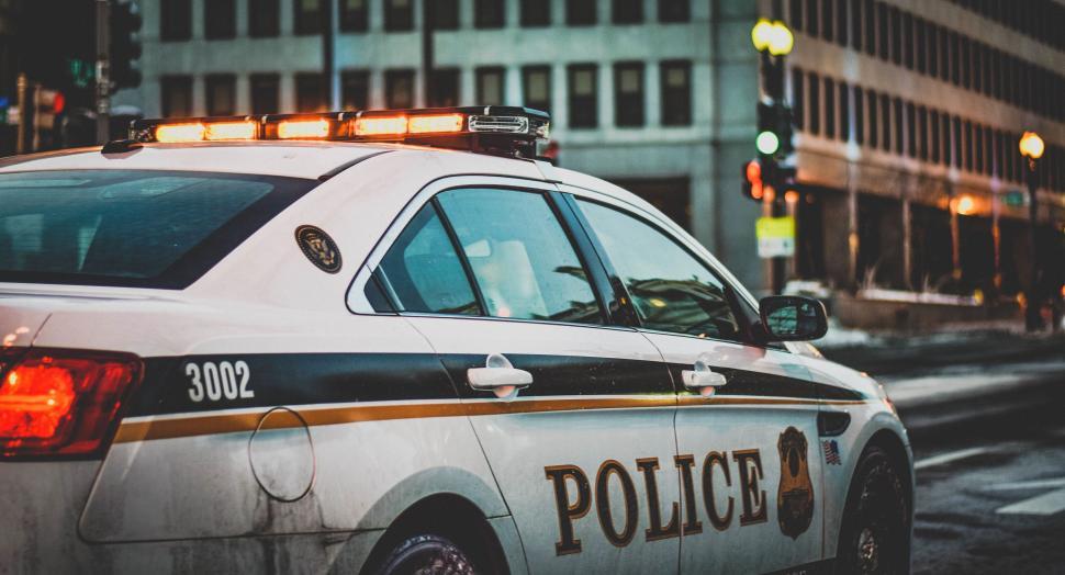 Free Image of Police Car Parked on Side of Road 