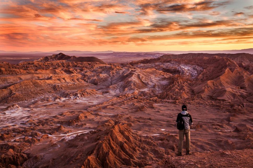 Free Image of Man Standing on Rocky Hillside 