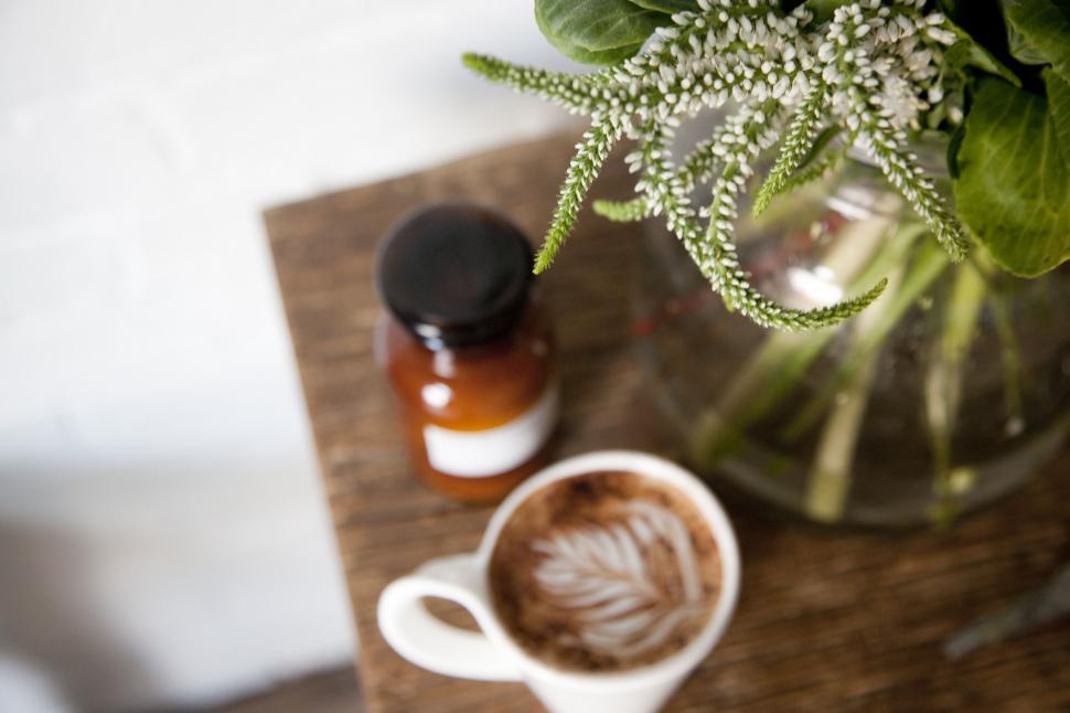 Free Image of A Cup of Coffee on Wooden Table 