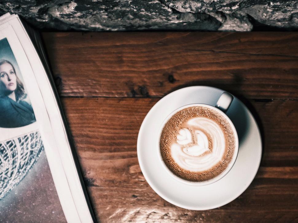 Free Image of A Cup of Coffee on Wooden Table 
