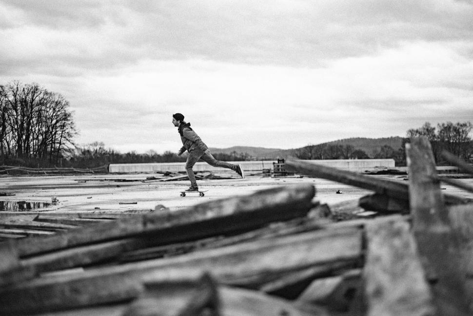 Free Image of Person Riding Skateboard in Black and White 