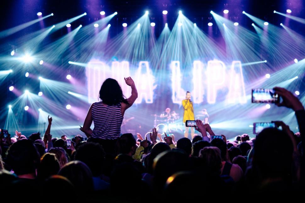 Free Image of Group of People Standing on Top of a Stage 