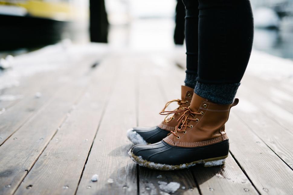 Free Image of Person Standing on Top of Wooden Floor 