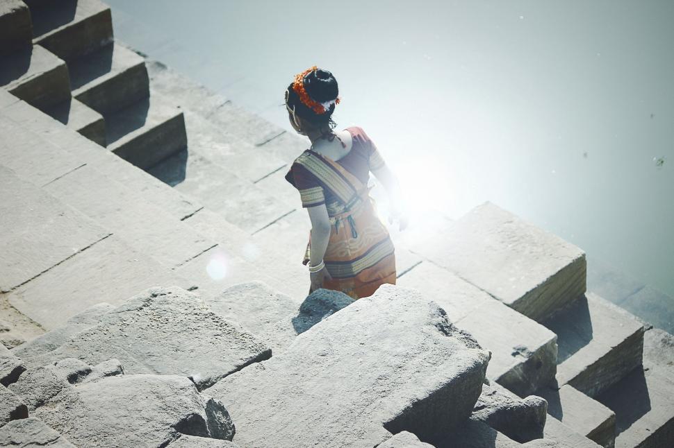 Free Image of Person Standing on Top of Stone Structure 
