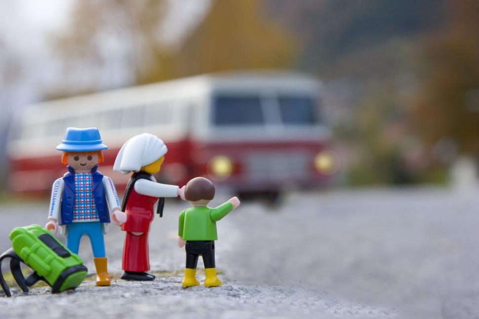 Couple of Figurines Standing on a Road