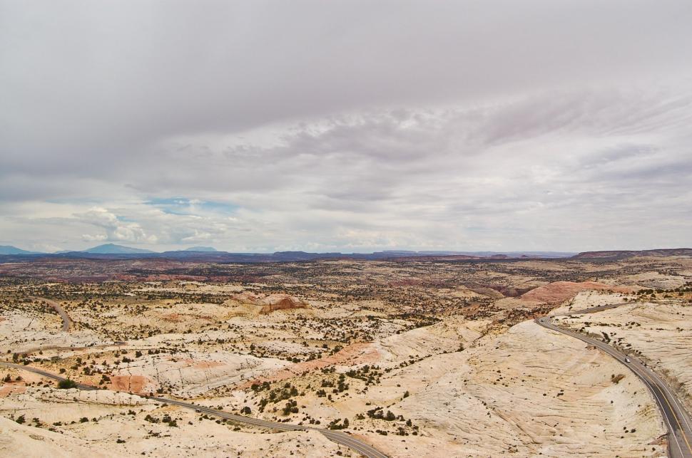 Free Image of Dirt Road Cutting Through Desert Landscape 