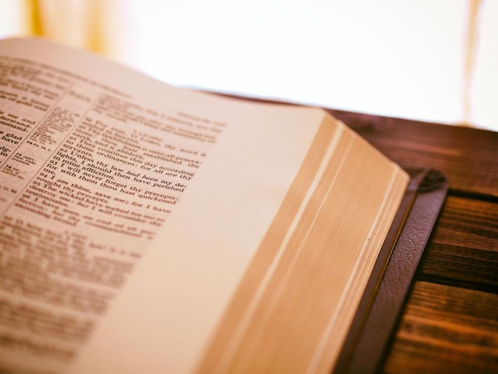 Free Image of Open Book on Wooden Table 