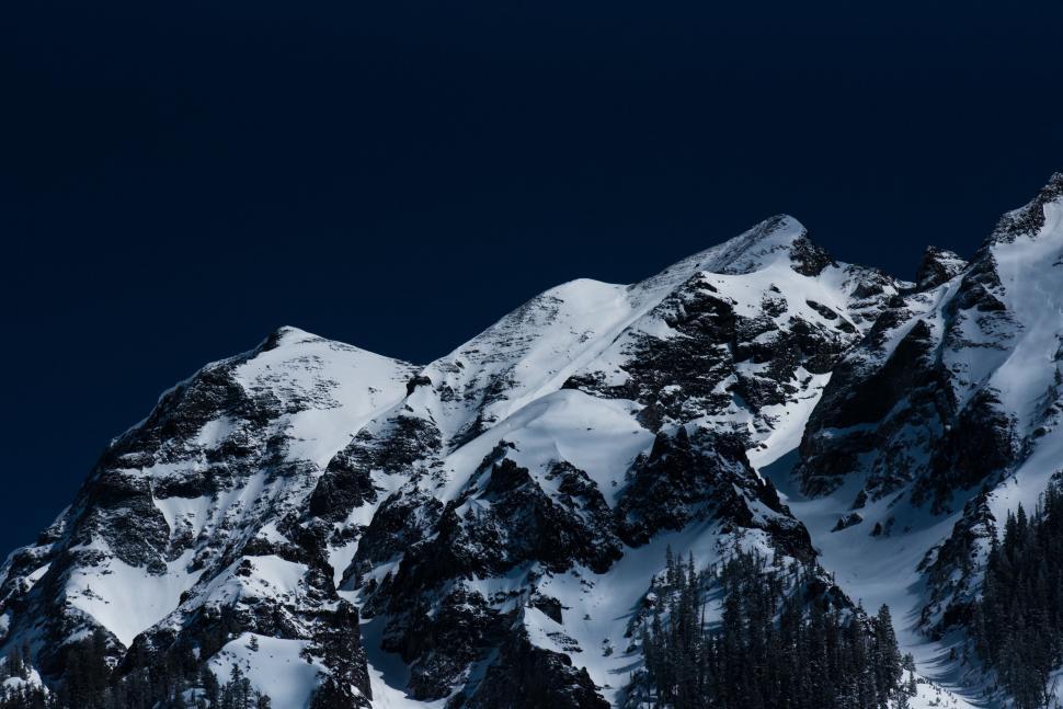 Free Image of Snow Covered Mountain With Sky Background 