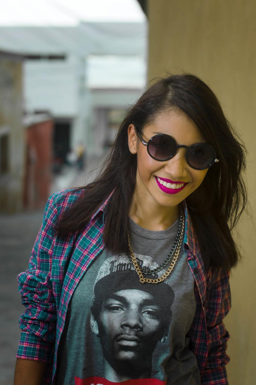 Free Image of Woman Wearing Shirt With Picture of Man 
