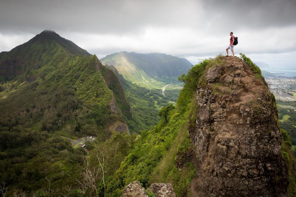 Free Image of Person Standing on Top of a Mountain 