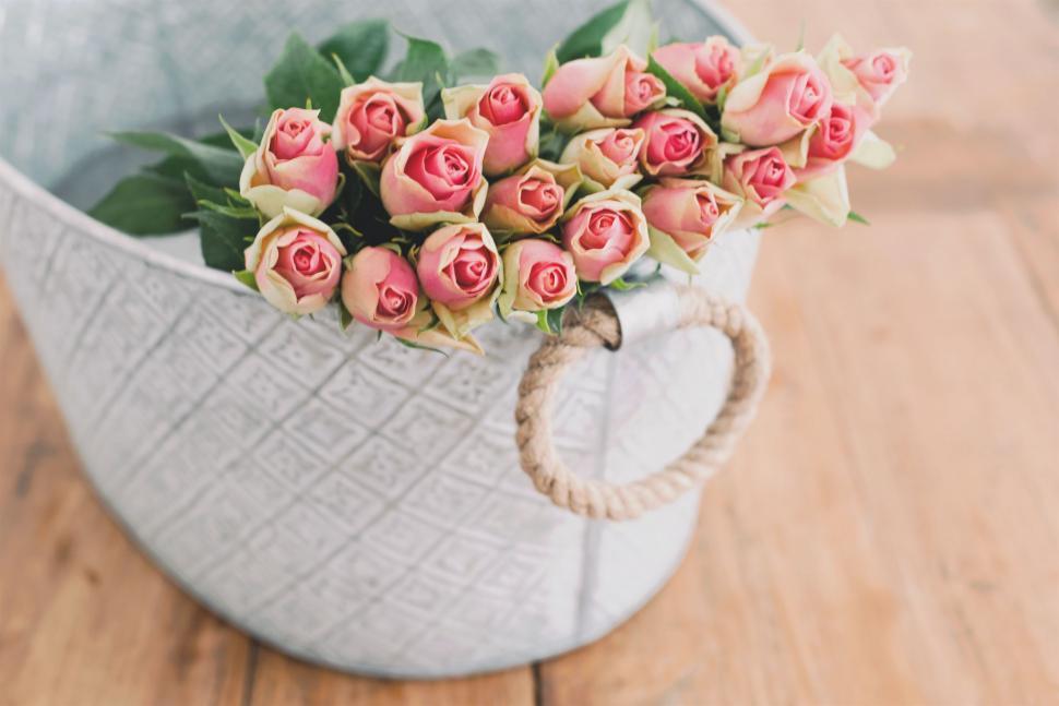Free Image of Colorful Flowers in Vase on Wooden Floor 