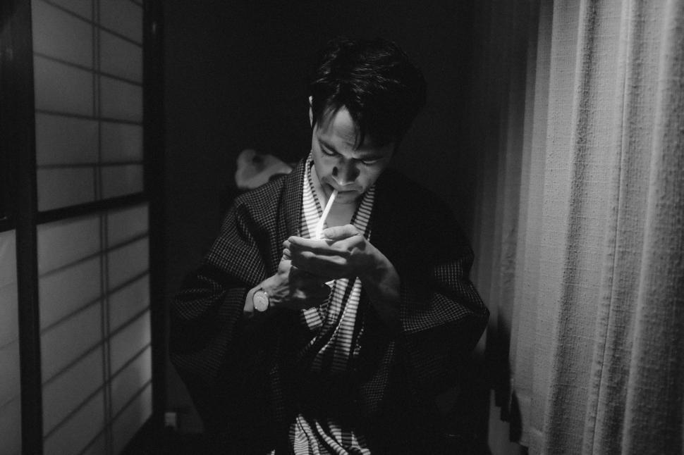 Free Image of Woman in Kimono Using Cell Phone 