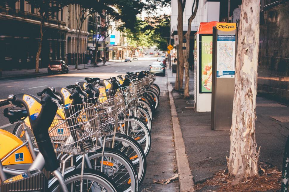 Free Image of Row of Bikes Parked on Sidewalk 