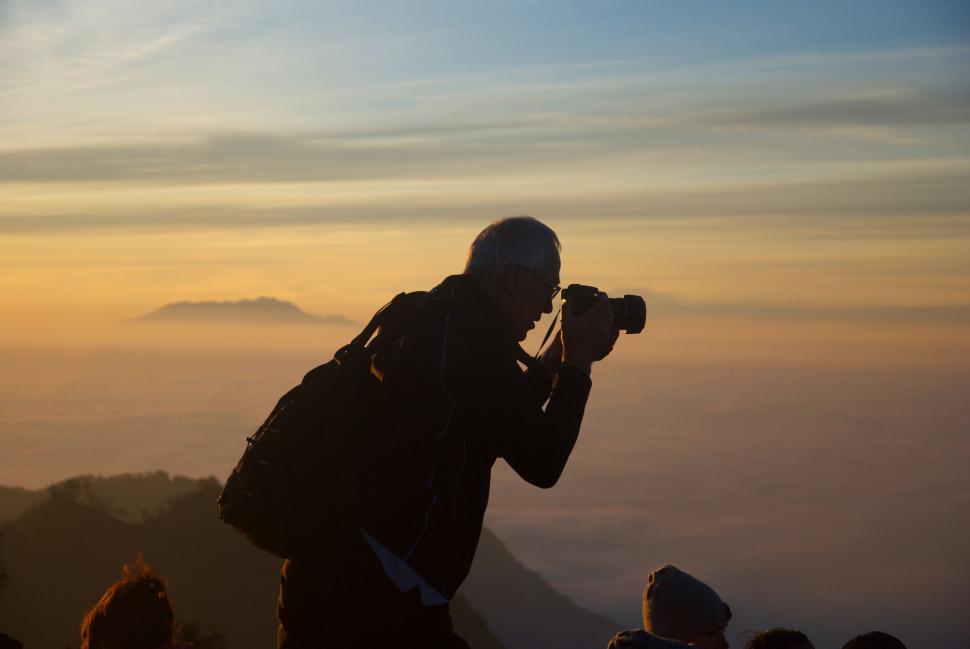 person-taking-a-picture-with-a-camera.jpg