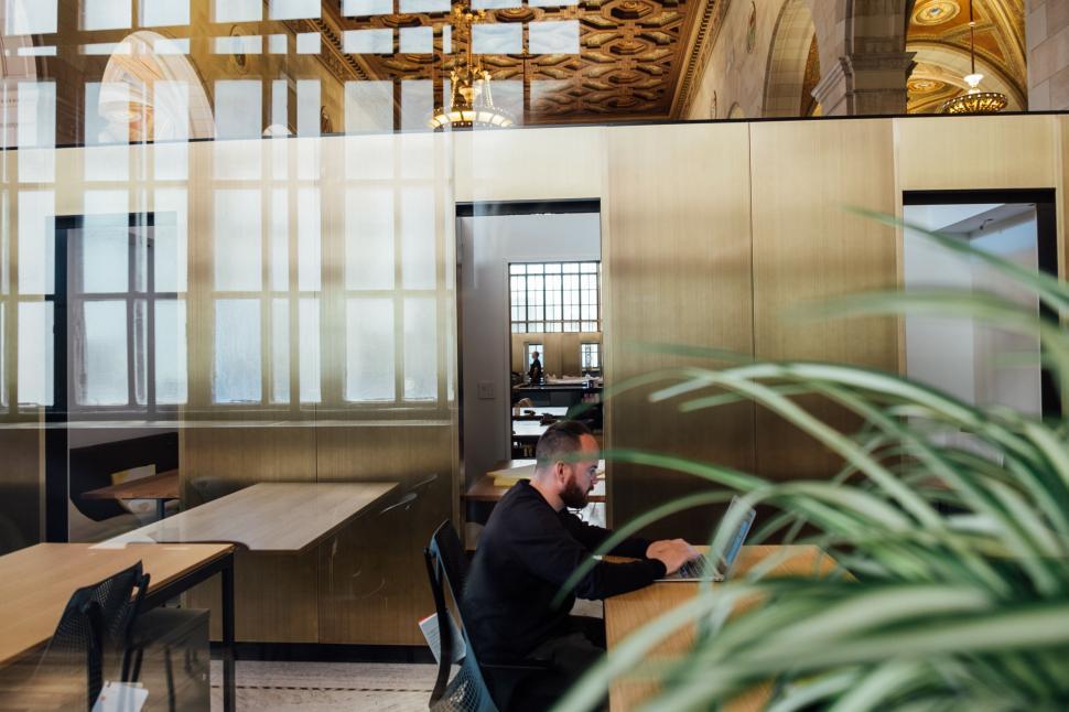 Free Image of Man Sitting at Desk in Office 
