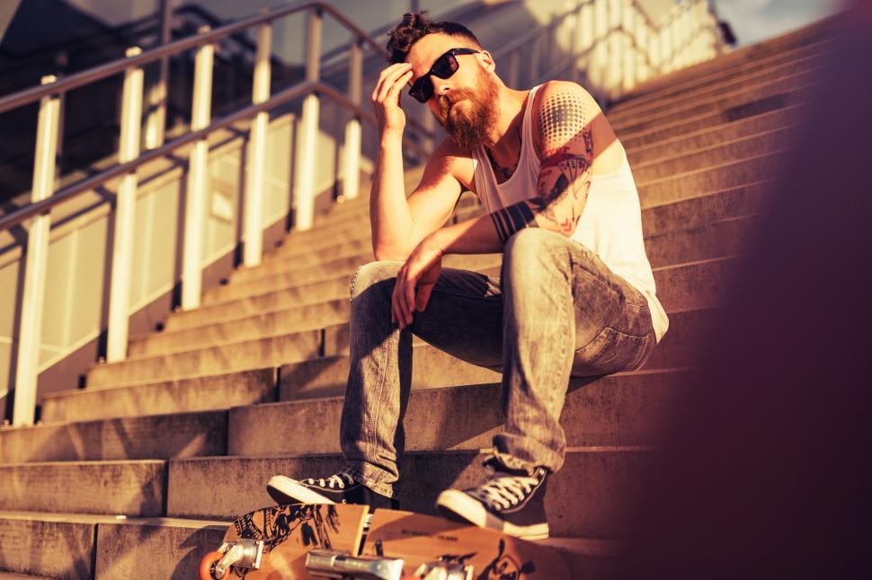 Free Image of Man Riding Skateboard Down Flight of Stairs 