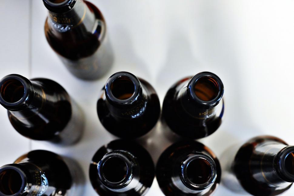 Free Image of Group of Black Bottles Arranged Together 