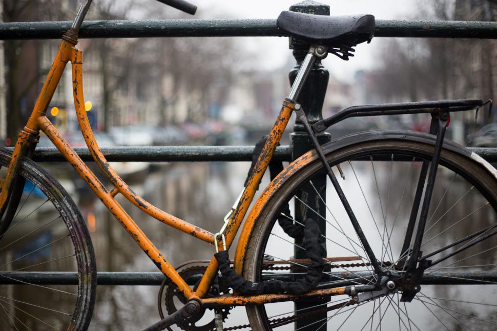 Free Image of Bicycle Locked to Metal Fence 