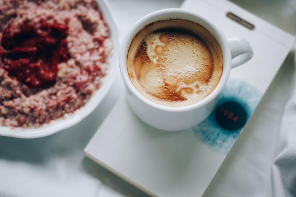 Free Image of Coffee Cup Next to Bowl of Food 