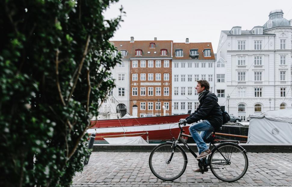 Free Image of Man Sitting on Bench With Bike 