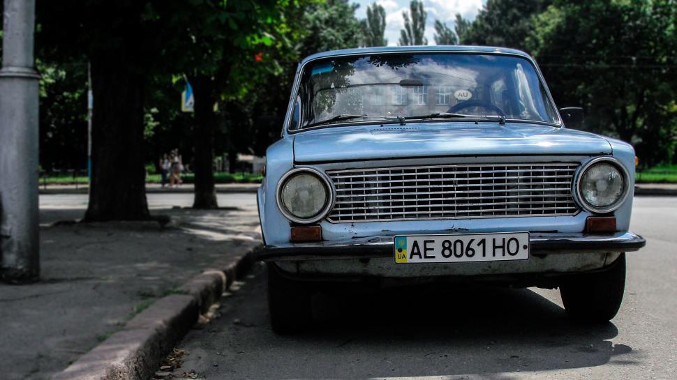 Free Image of Blue Car Parked on Side of Road 