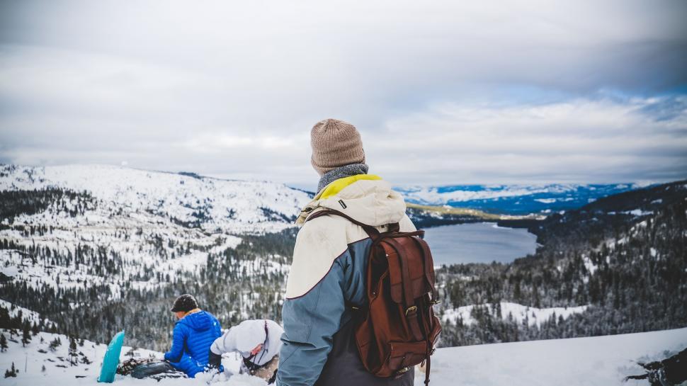 Free Image of Man Standing on Snow-Covered Slope 