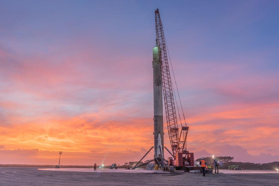Free Image of Crane Resting on Beach at Sunset 