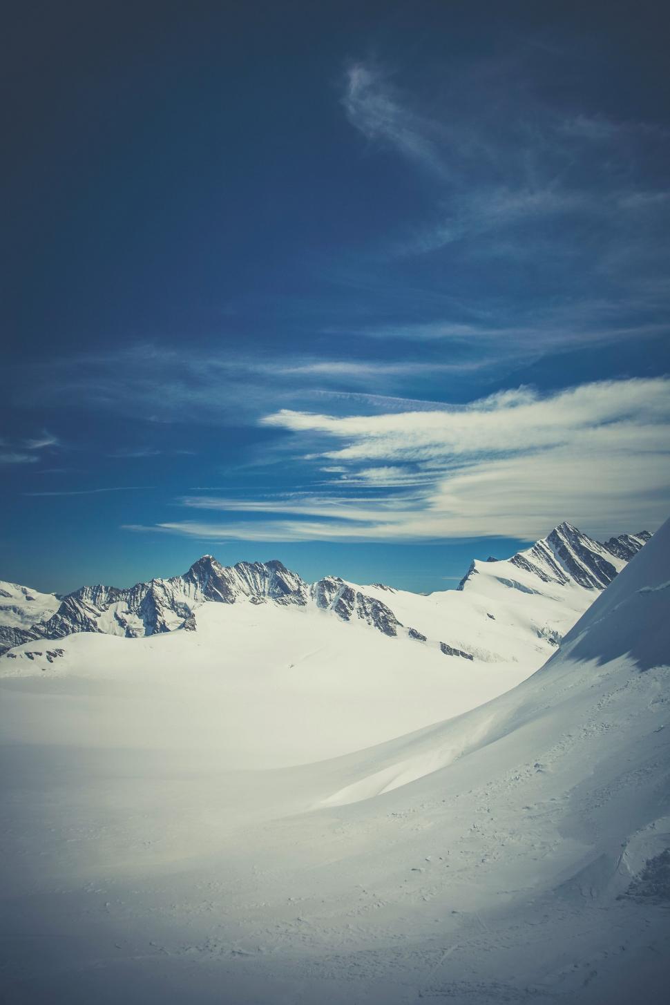 Free Image of Person Skiing Down Snow Covered Slope 