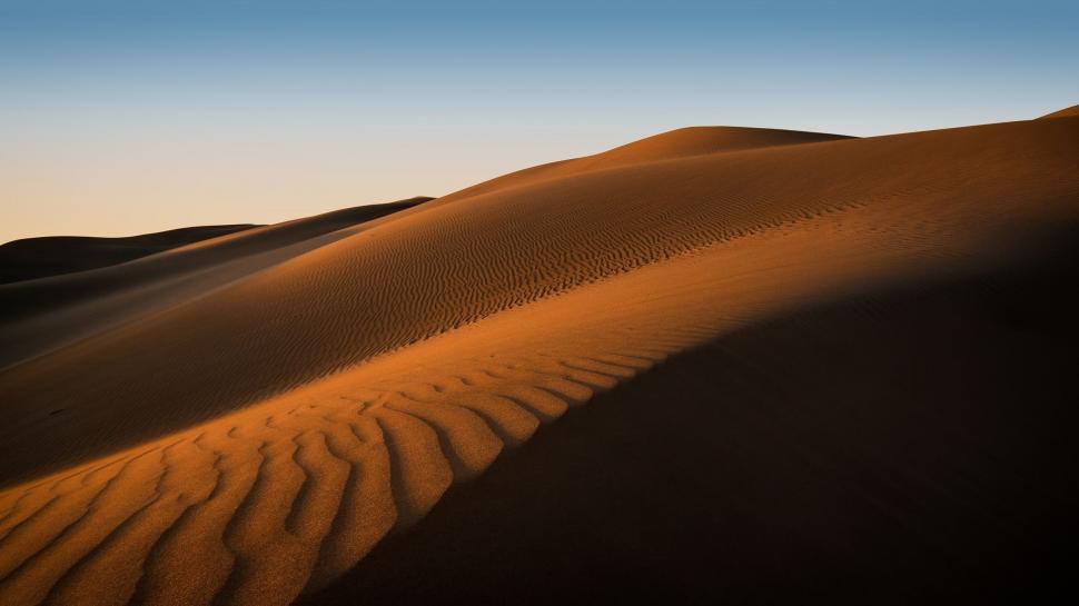 Free Image of Desert Landscape With Sand Dunes and Blue Sky 
