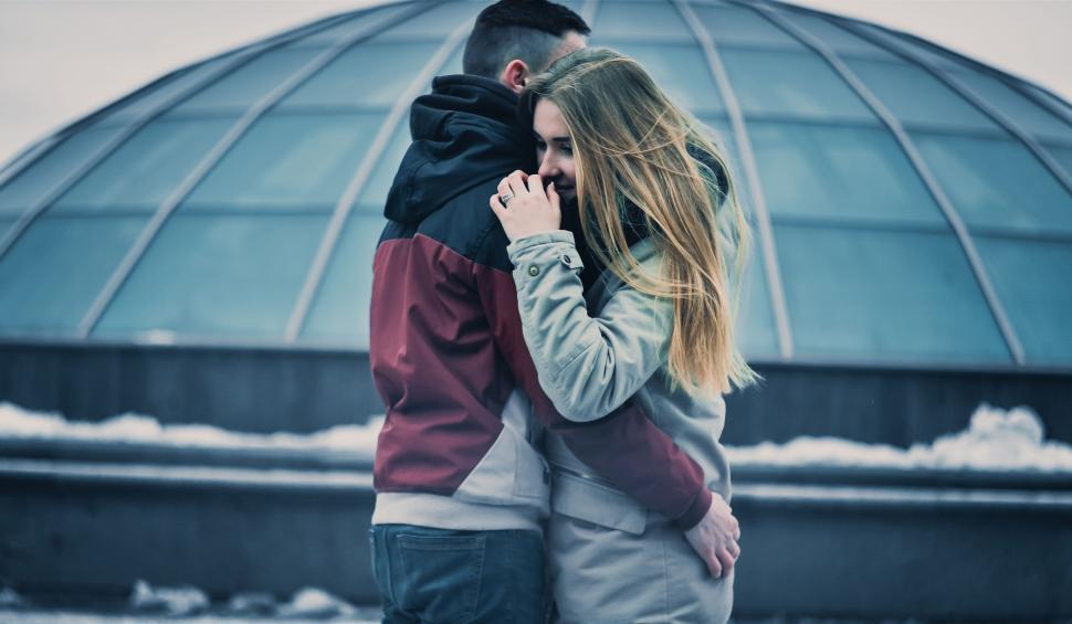 Free Image of Man and Woman Embracing in Front of Dome 
