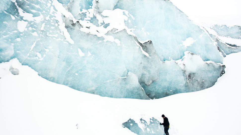 Free Image of Man Standing on Snow Covered Slope 