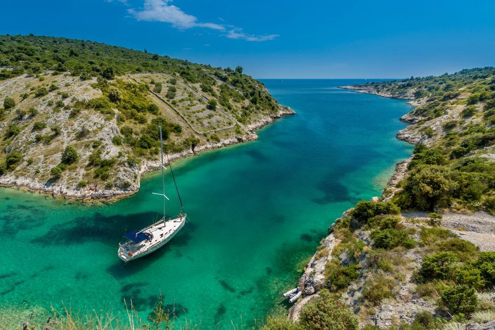 Free Image of Boat Floating on Body of Water 