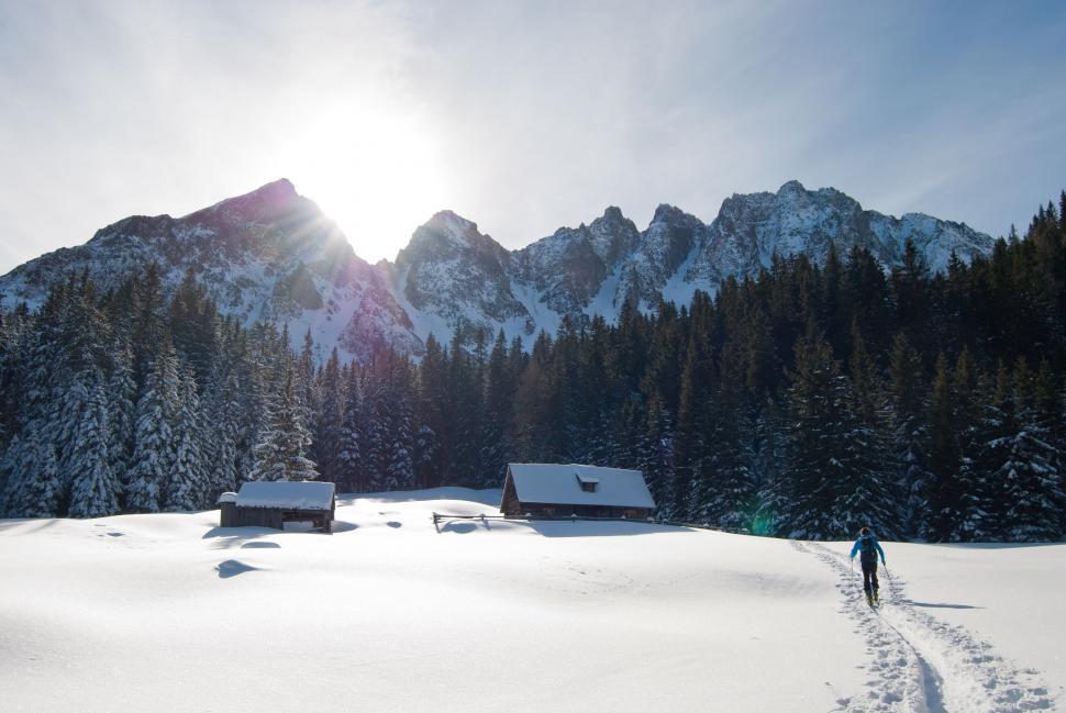 Free Image of Person Walking Across Snow Covered Field 