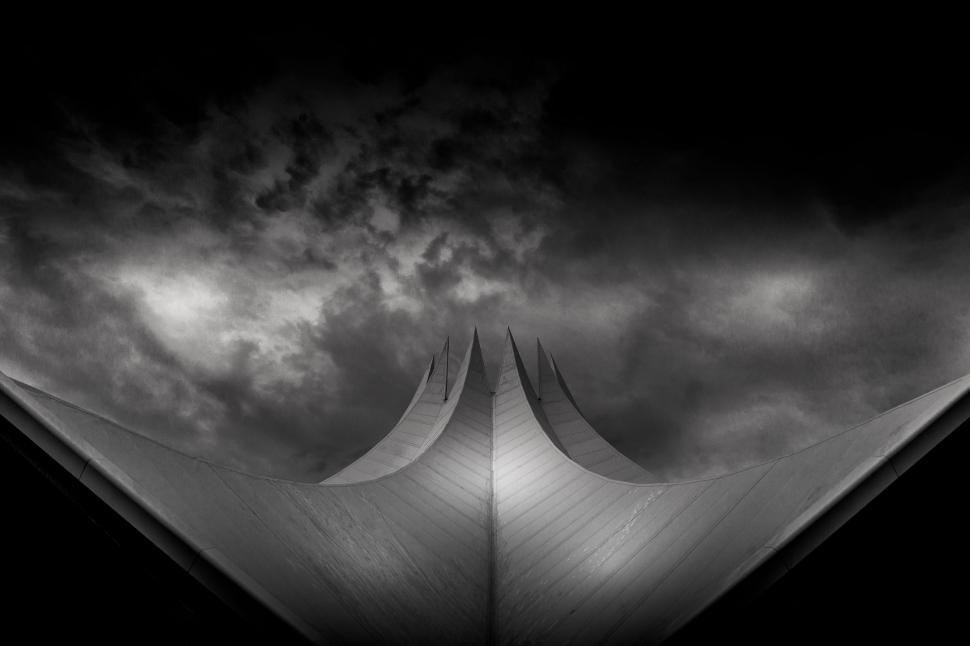 Free Image of Building With Clouds in Background 