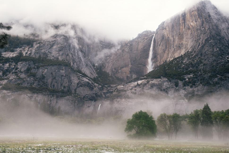 Free Image of Horse Standing in Front of Waterfall 