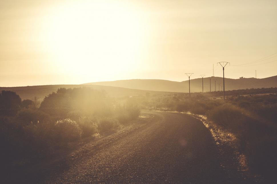 Free Image of Sun Shining Over Rural Road 
