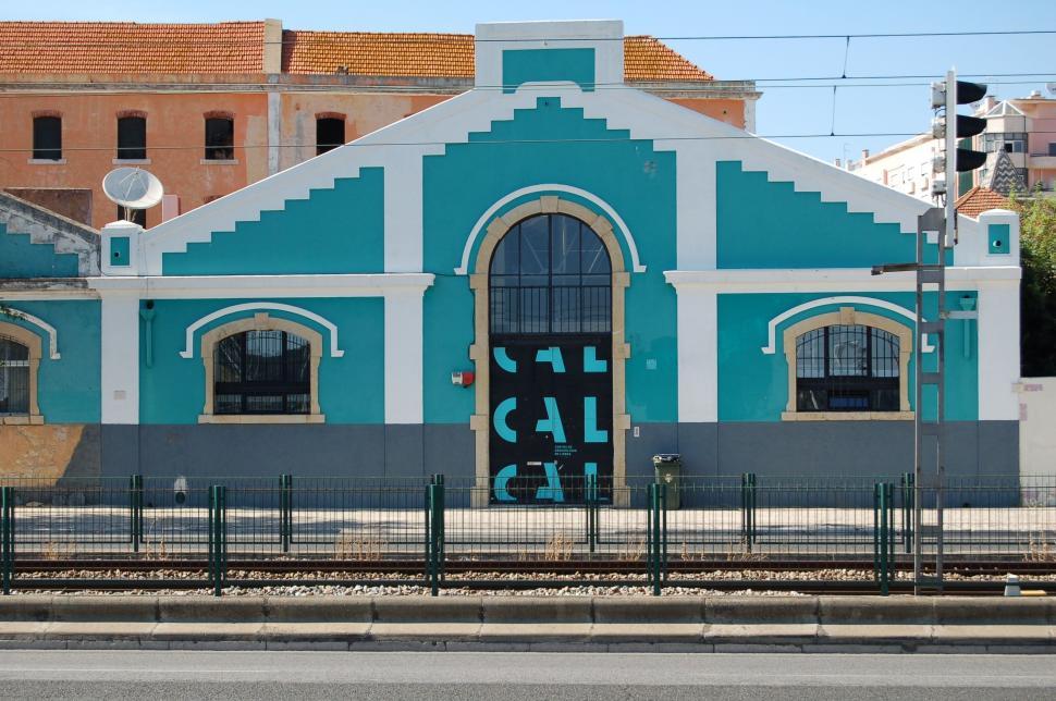 Free Image of Blue and White Building With Black Door 