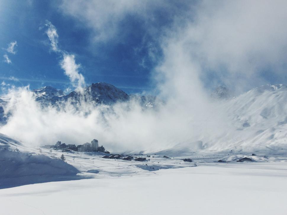 Free Image of Snow Covered Mountain With Clouds in the Sky 