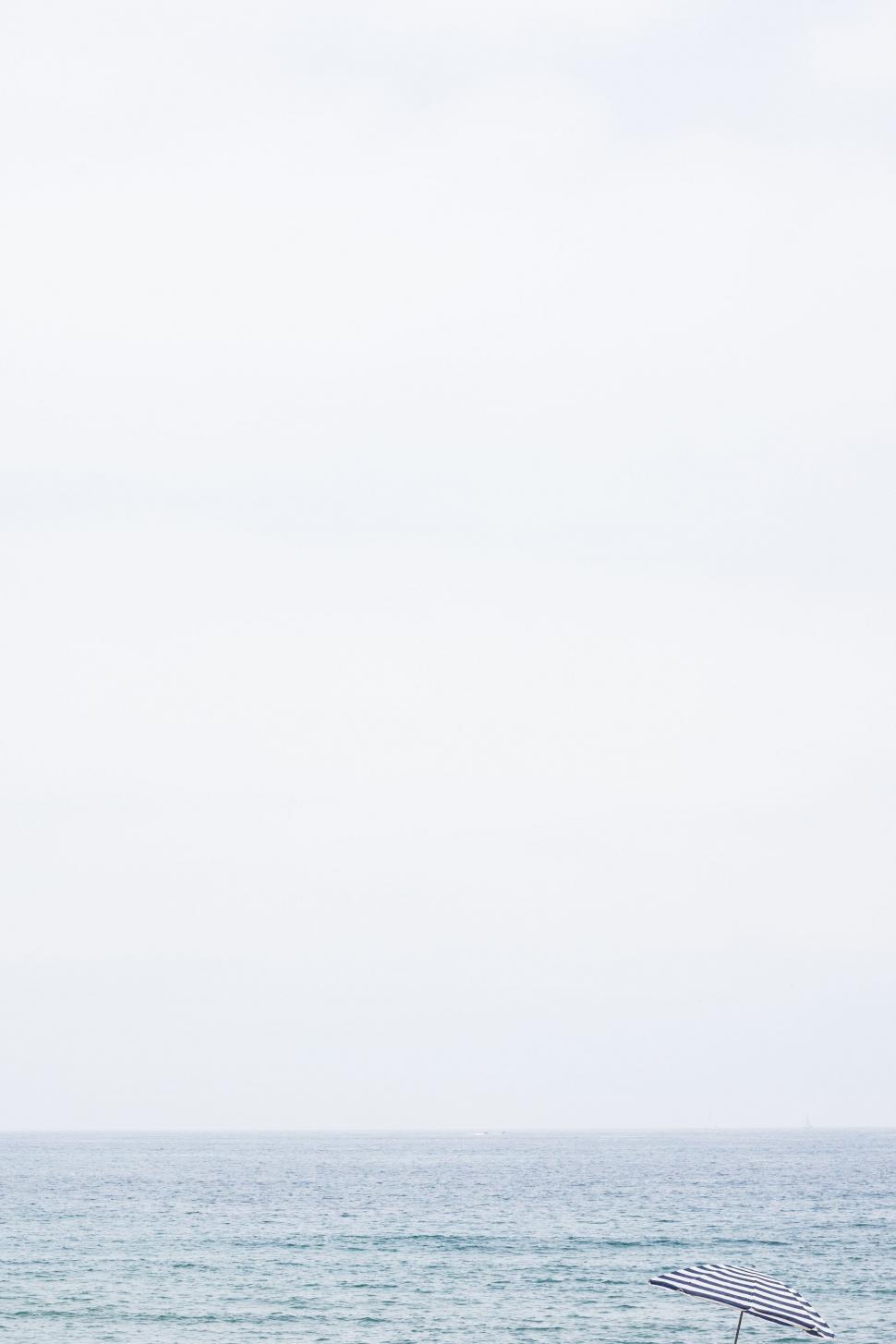 Free Image of Man Riding Surfboard on Wave in Ocean 