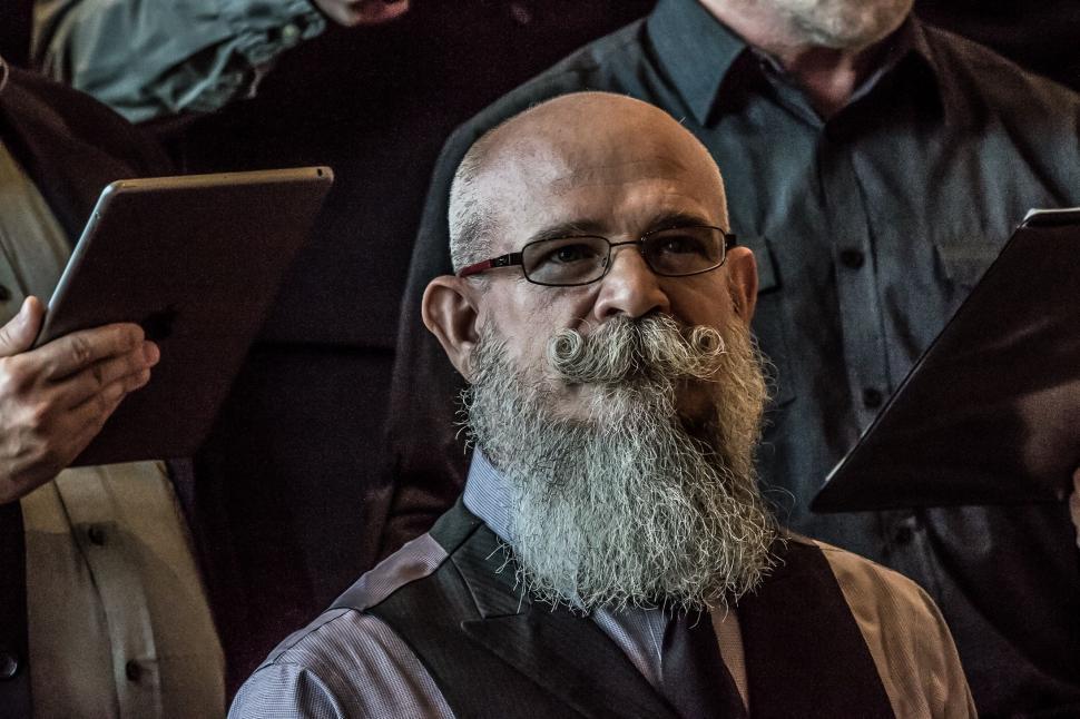 Free Image of Man With Beard and Glasses Holding Tablet 
