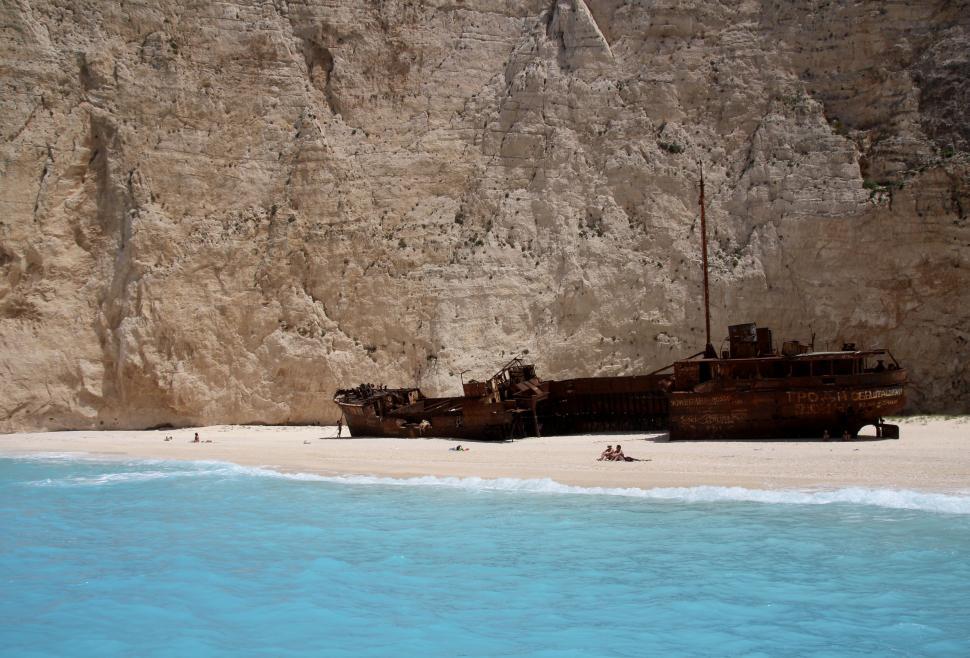 Free Image of Boat Resting on Sandy Beach 