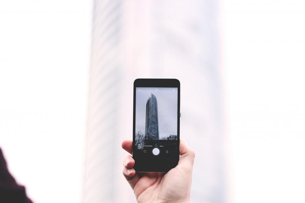 Free Image of Person Taking Picture of Building With Cell Phone 