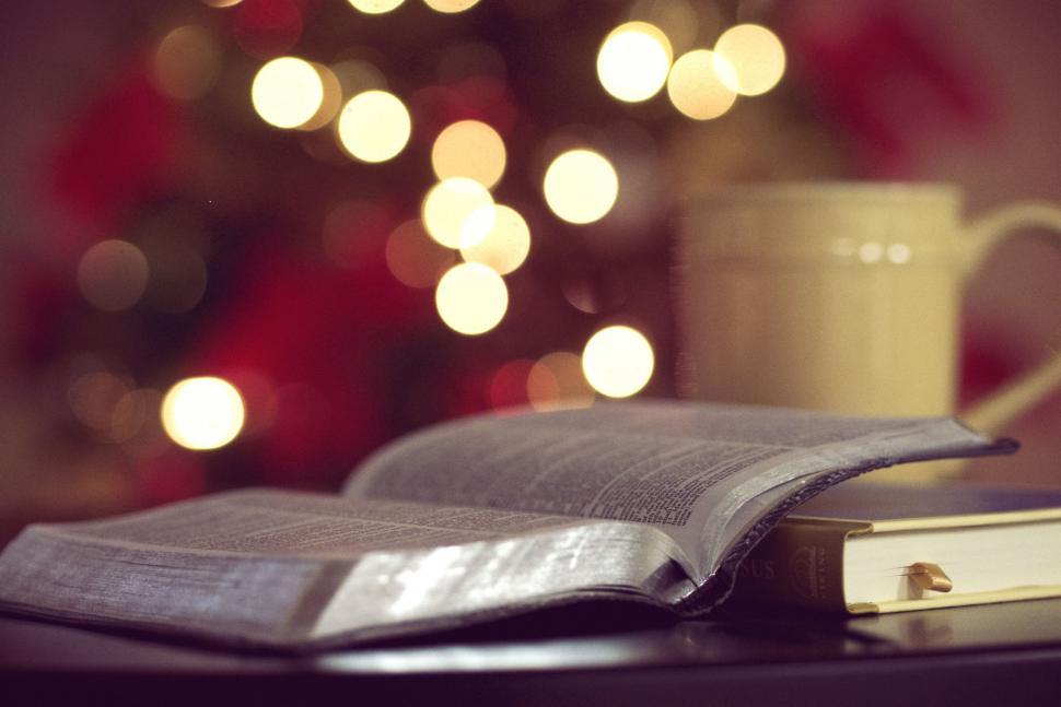 Free Image of Coffee Cup and Book on Table 